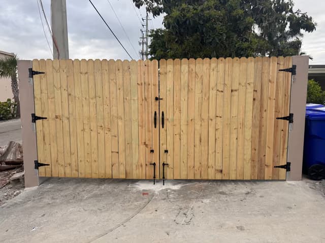 New wooden privacy gate installed at a home