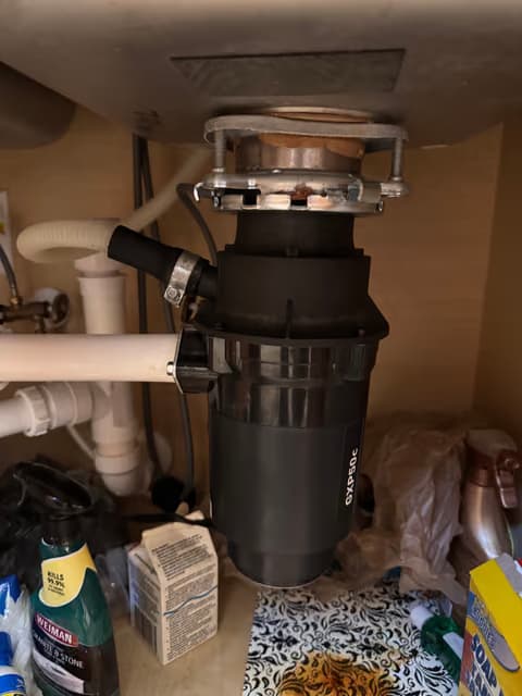 Garbage disposal unit installed under a kitchen sink