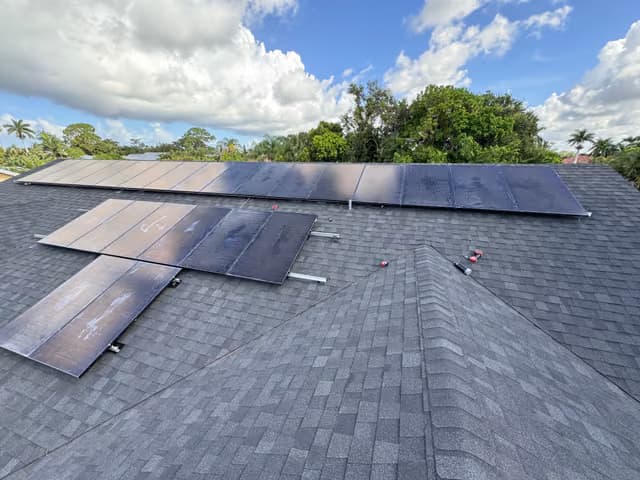 Solar panels being installed on a roof