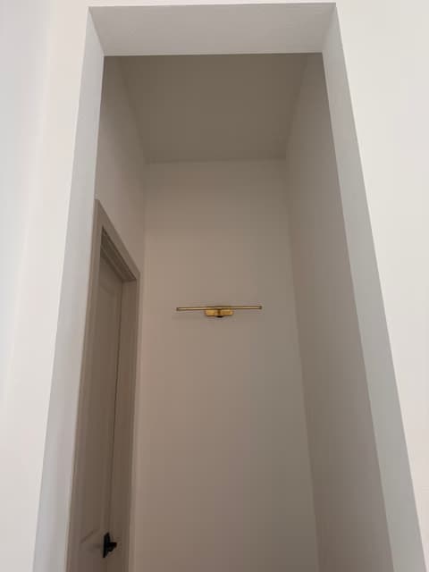 Empty hallway nook with a new single pendant light installed