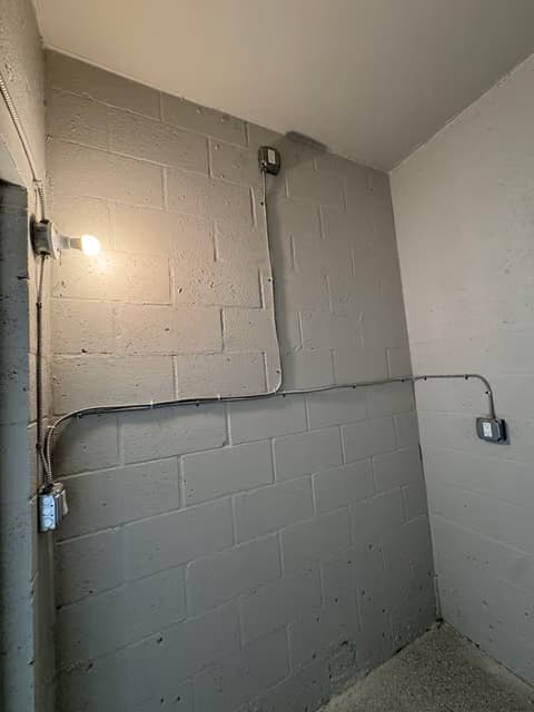 Interior block wall wired for a new electrical outlet