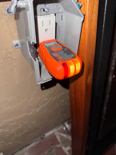 Exterior electrical meter and disconnect box mounted on a wall