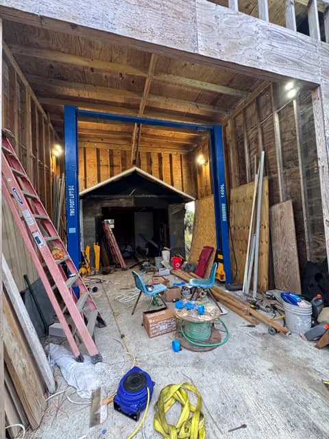 Framing and structural work in progress on a garage or home addition