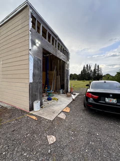 Home addition under construction with new exterior siding